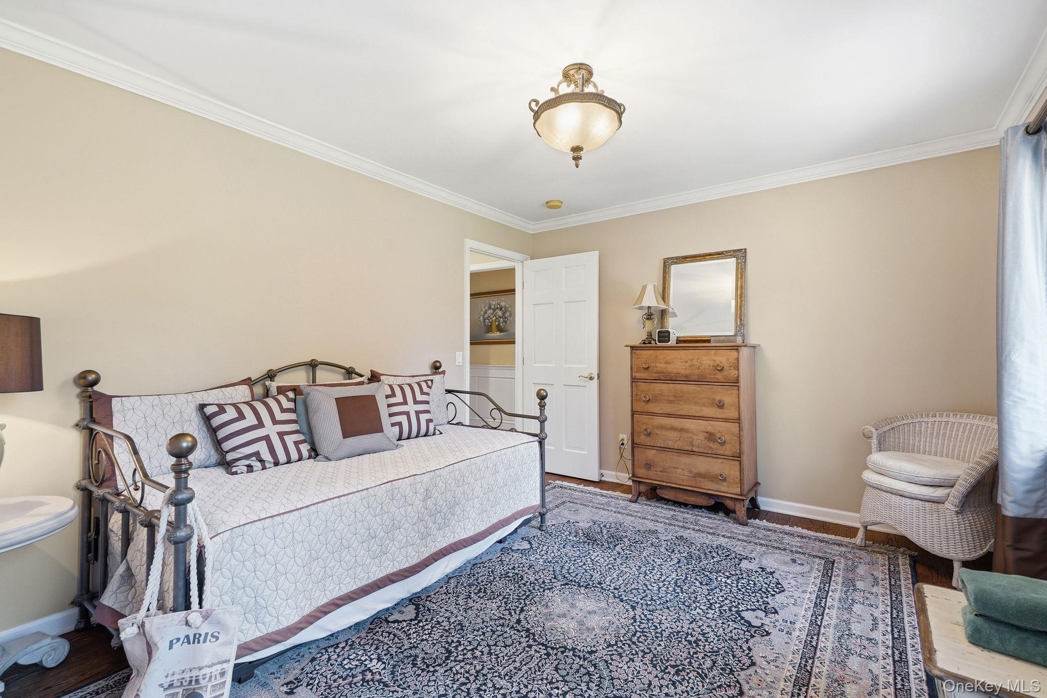 33 Hevelyne Road Elmsford, NY 10523 - Photo 23 of 43 Hardwood floors in 3rd bedroom with crown molding and a closet