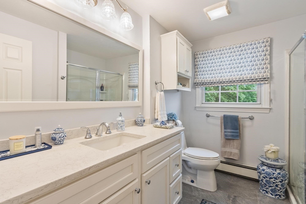 134 River Road Lowell, MA 01852 - Photo 19 of 36 a bathroom with a sink toilet vanity and a window