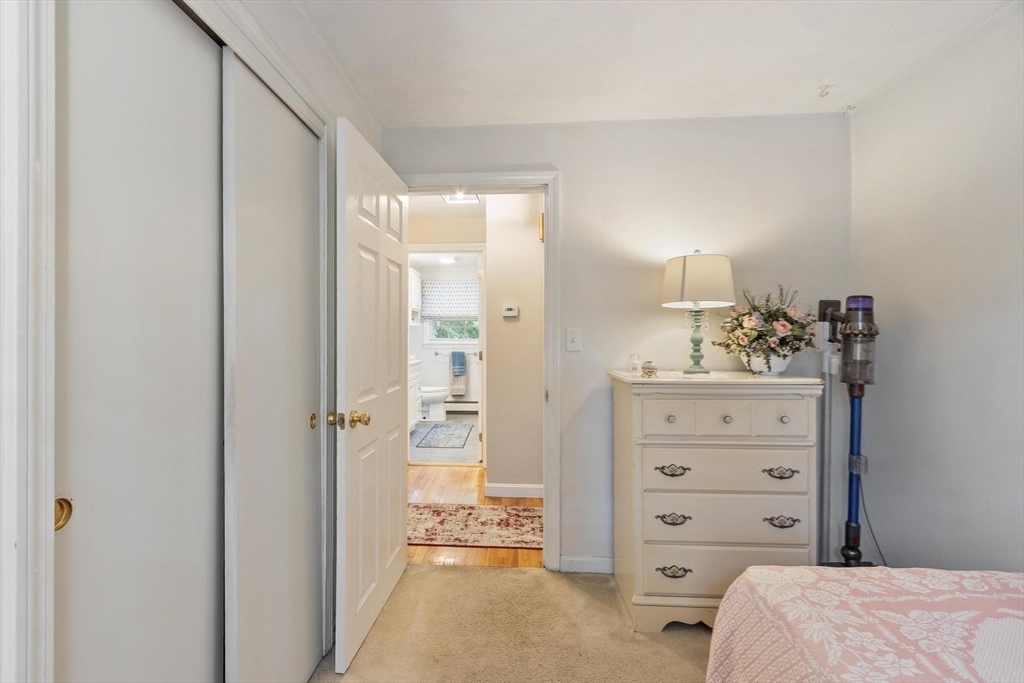 134 River Road Lowell, MA 01852 - Photo 24 of 36 a bedroom with a bed and a dresser