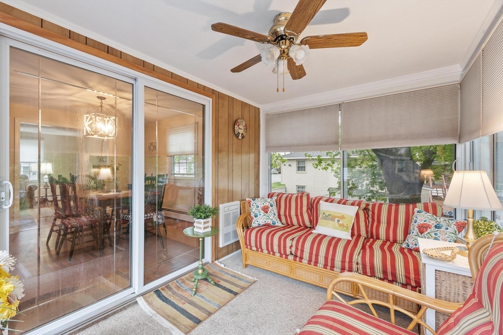 134 River Road Lowell, MA 01852 - Photo 25 of 36 a living room with furniture and a floor to ceiling window