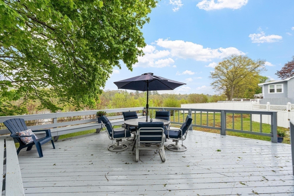 134 River Road Lowell, MA 01852 - Photo 31 of 36 a view of chairs and tables in the patio