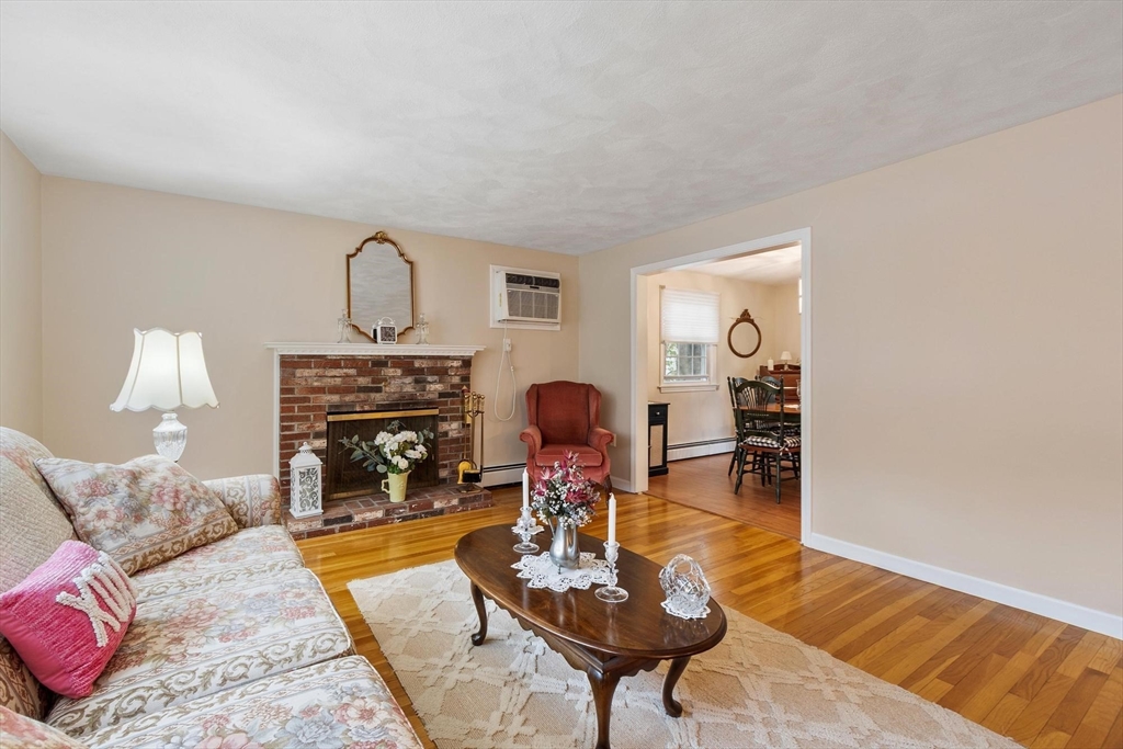 134 River Road Lowell, MA 01852 - Photo 6 of 36 a living room with furniture and a fireplace