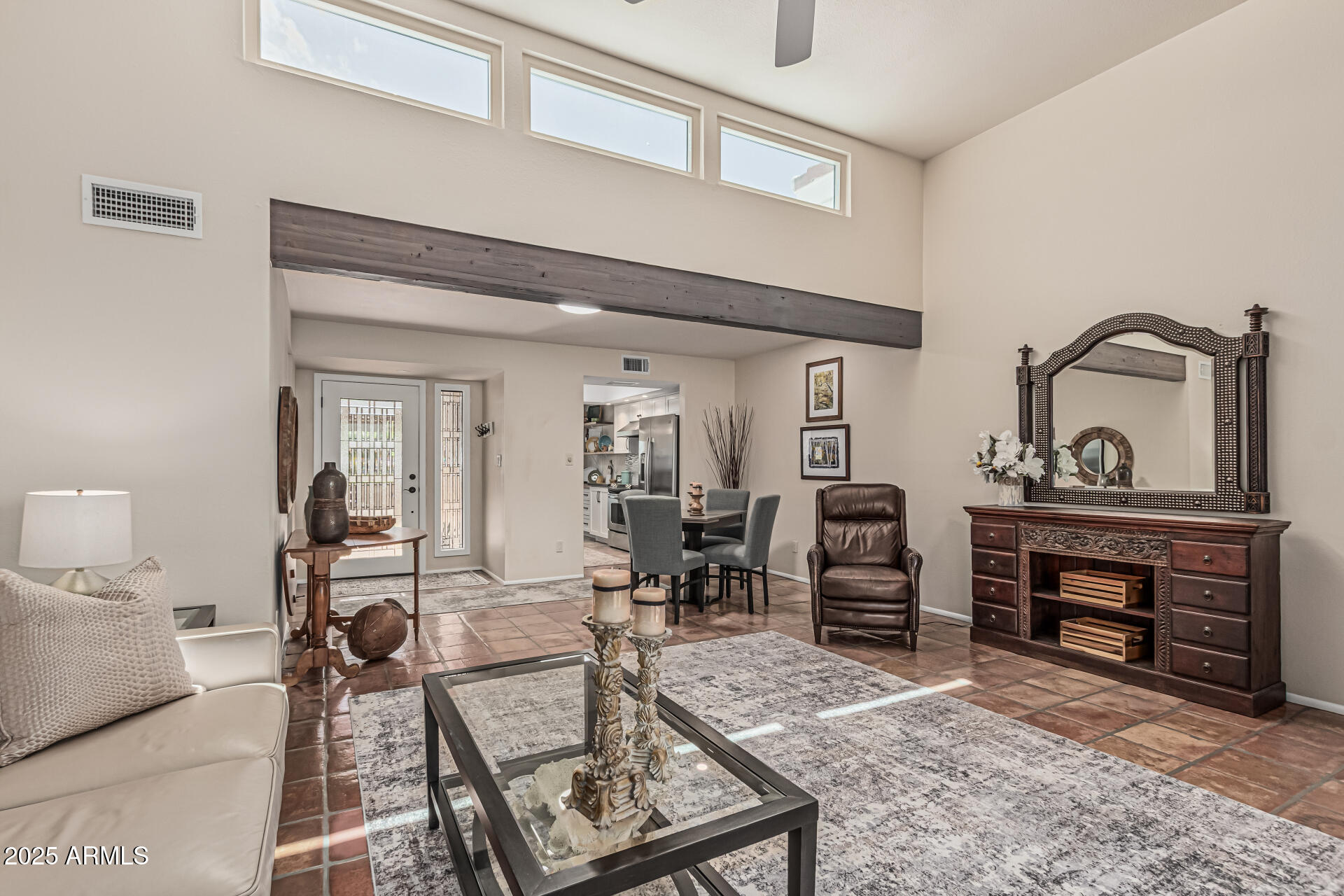a living room with furniture a fireplace and a table