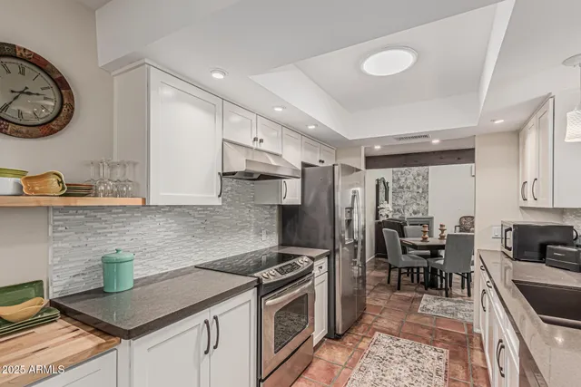 a bedroom with a bed and a view of balcony