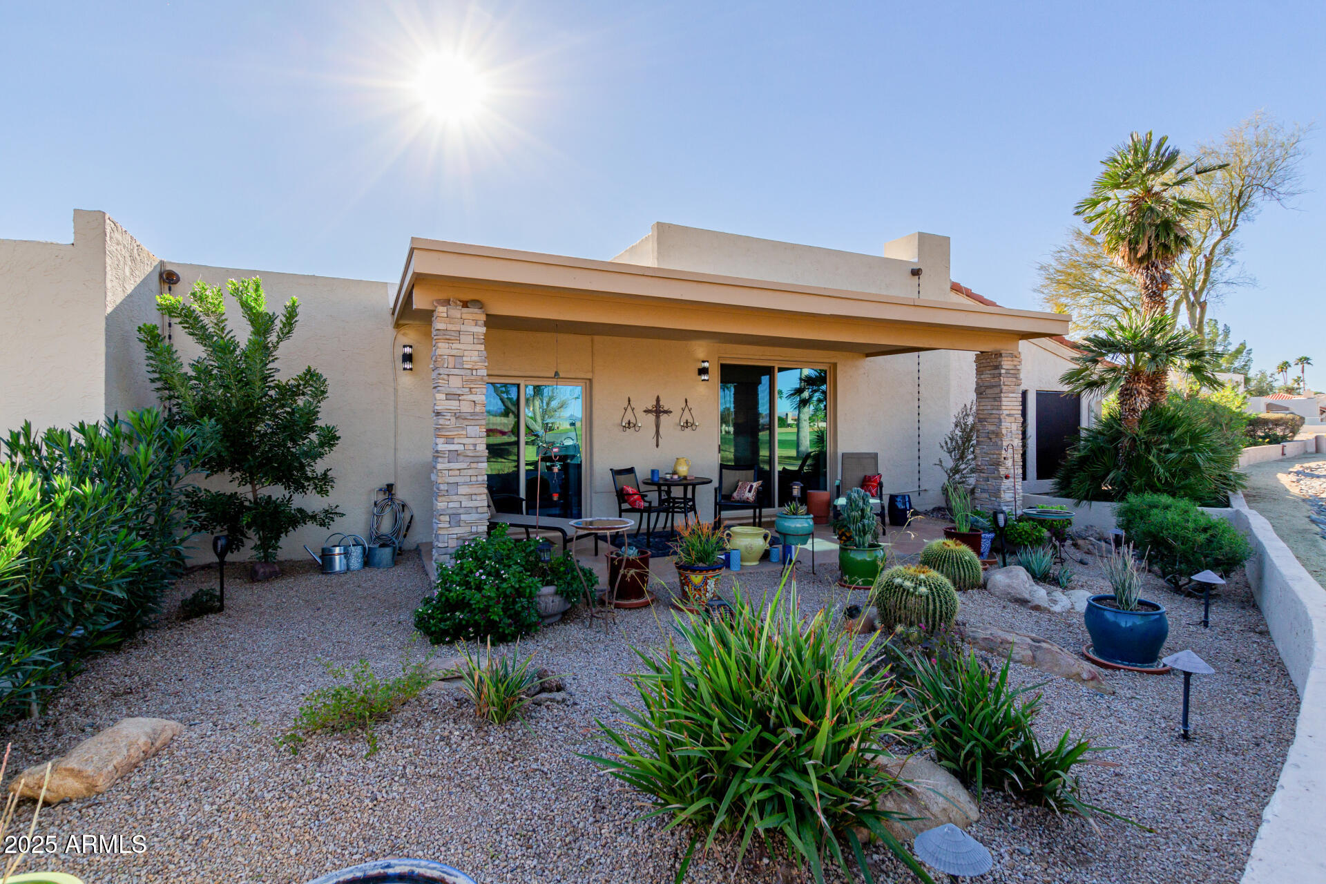 18718 East Rio Lane Rio Verde, AZ 85263 - Photo 17 of 59 a view of a patio with plants and chairs