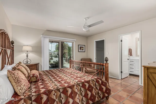 a bathroom with a sink toilet vanity and shower