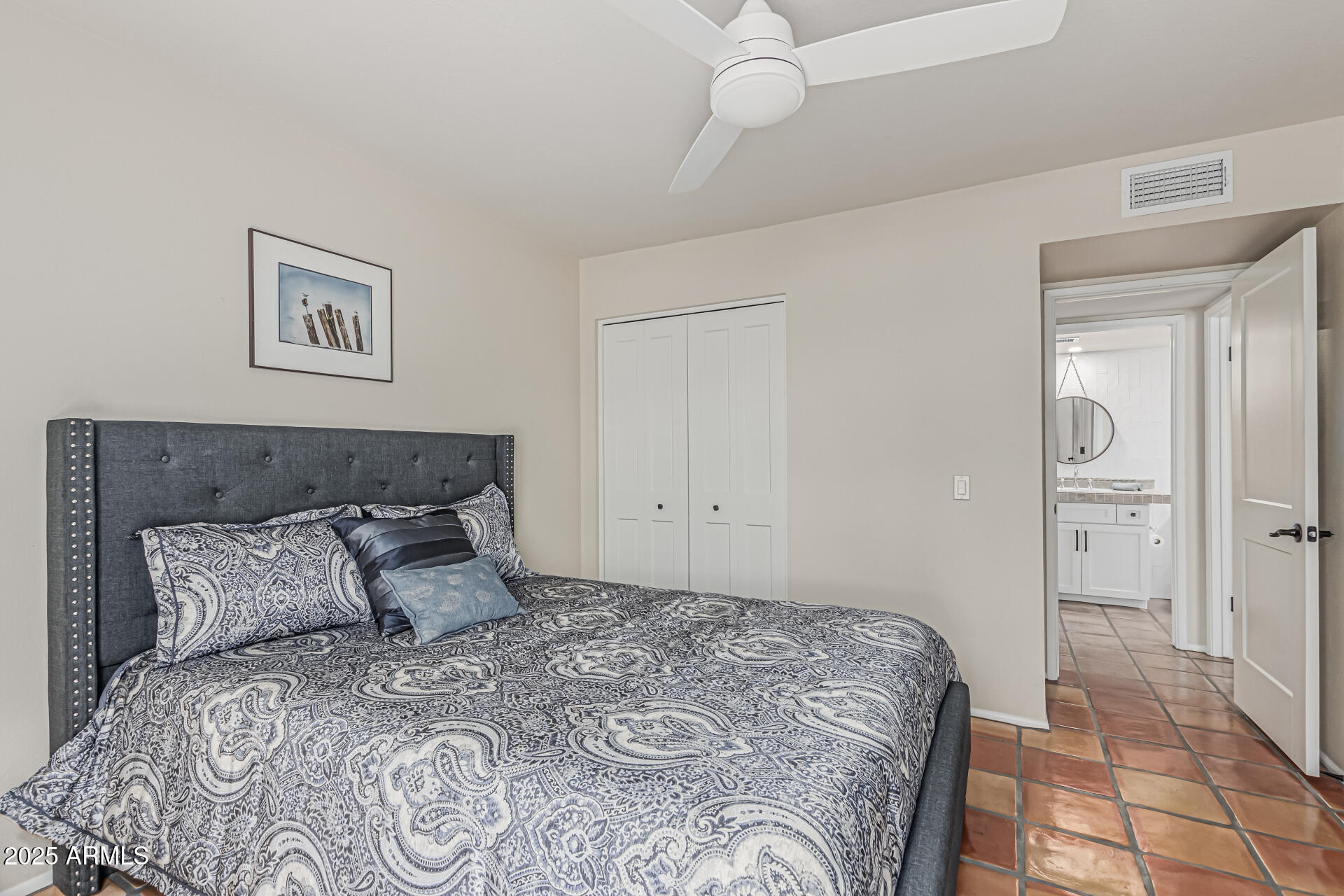 18718 East Rio Lane Rio Verde, AZ 85263 - Photo 24 of 59 a bedroom with a bed and a painting on the wall