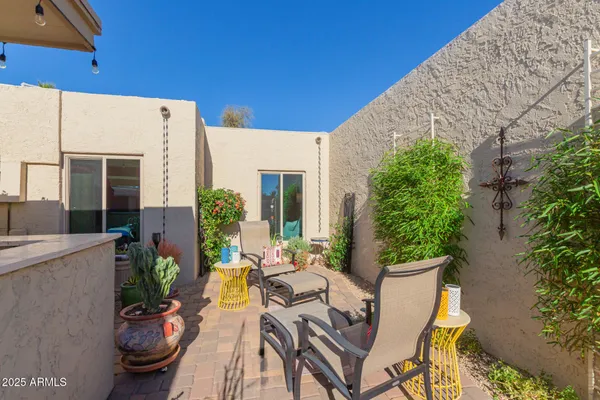an outdoor space with seating area and furniture