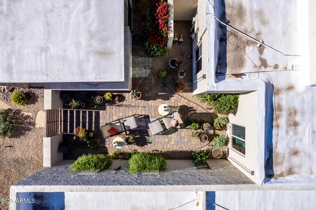 an aerial view of residential house with outdoor space and parking