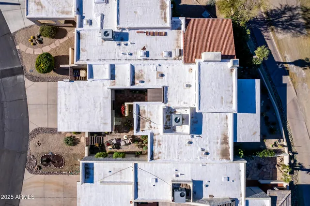 an aerial view of a house with a lake view
