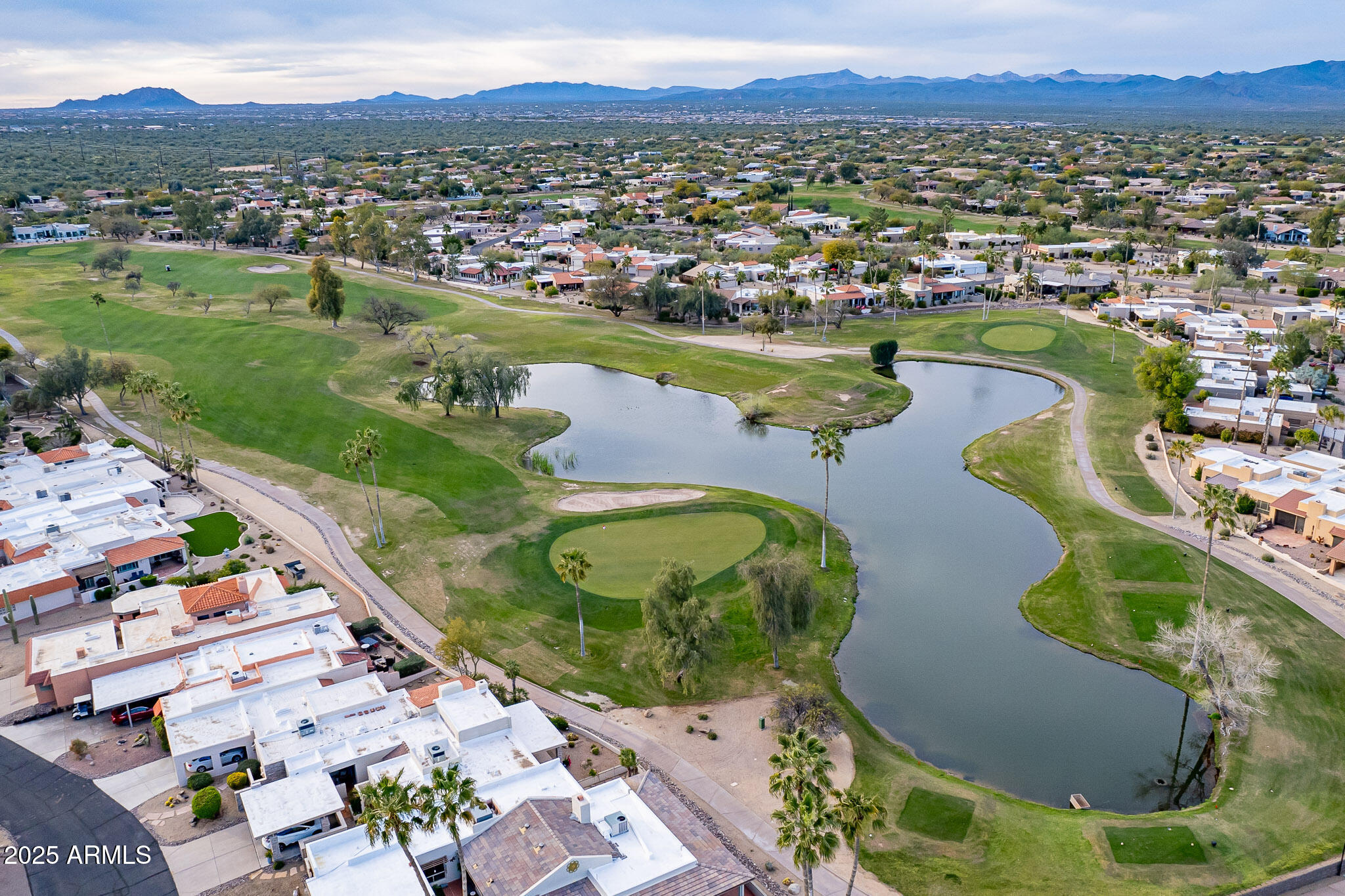 18718 East Rio Lane Rio Verde, AZ 85263 - Photo 4 of 59 an aerial view of a house with a garden and lake view