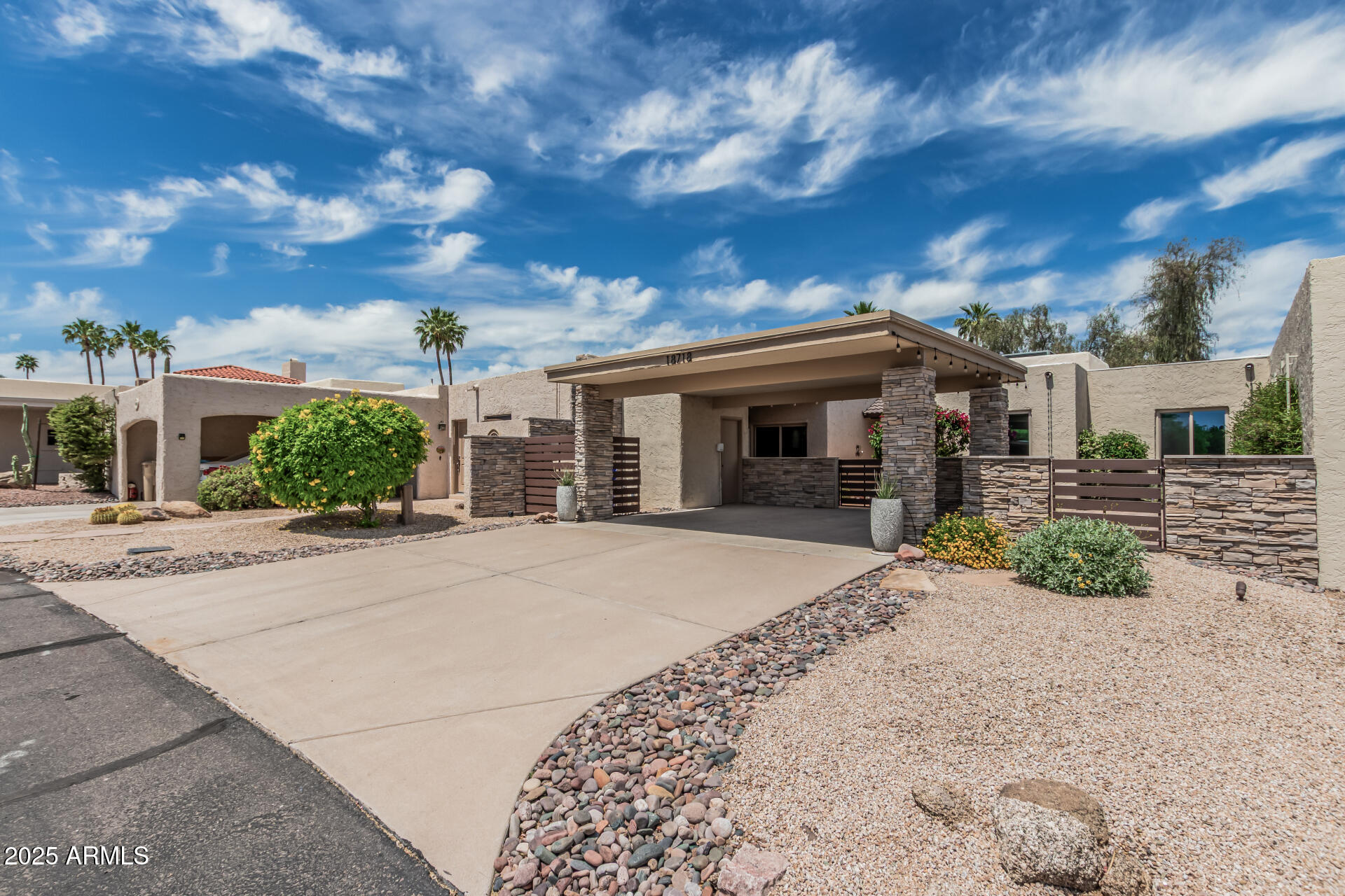 18718 East Rio Lane Rio Verde, AZ 85263 - Photo 52 of 59 front view of a house with a yard