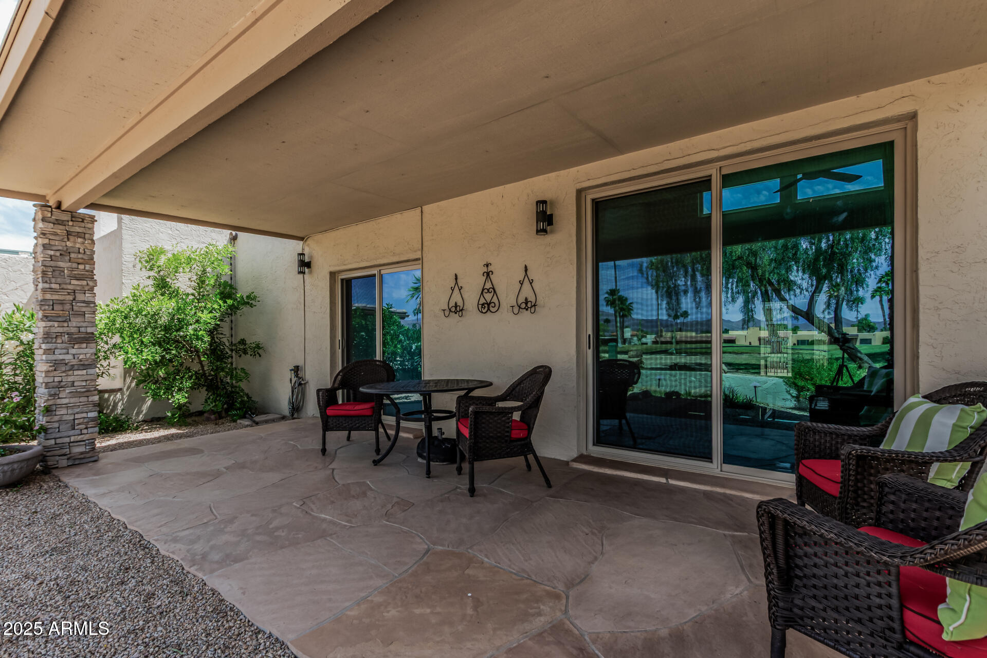 18718 East Rio Lane Rio Verde, AZ 85263 - Photo 57 of 59 a view of a patio with couches chairs and potted plants