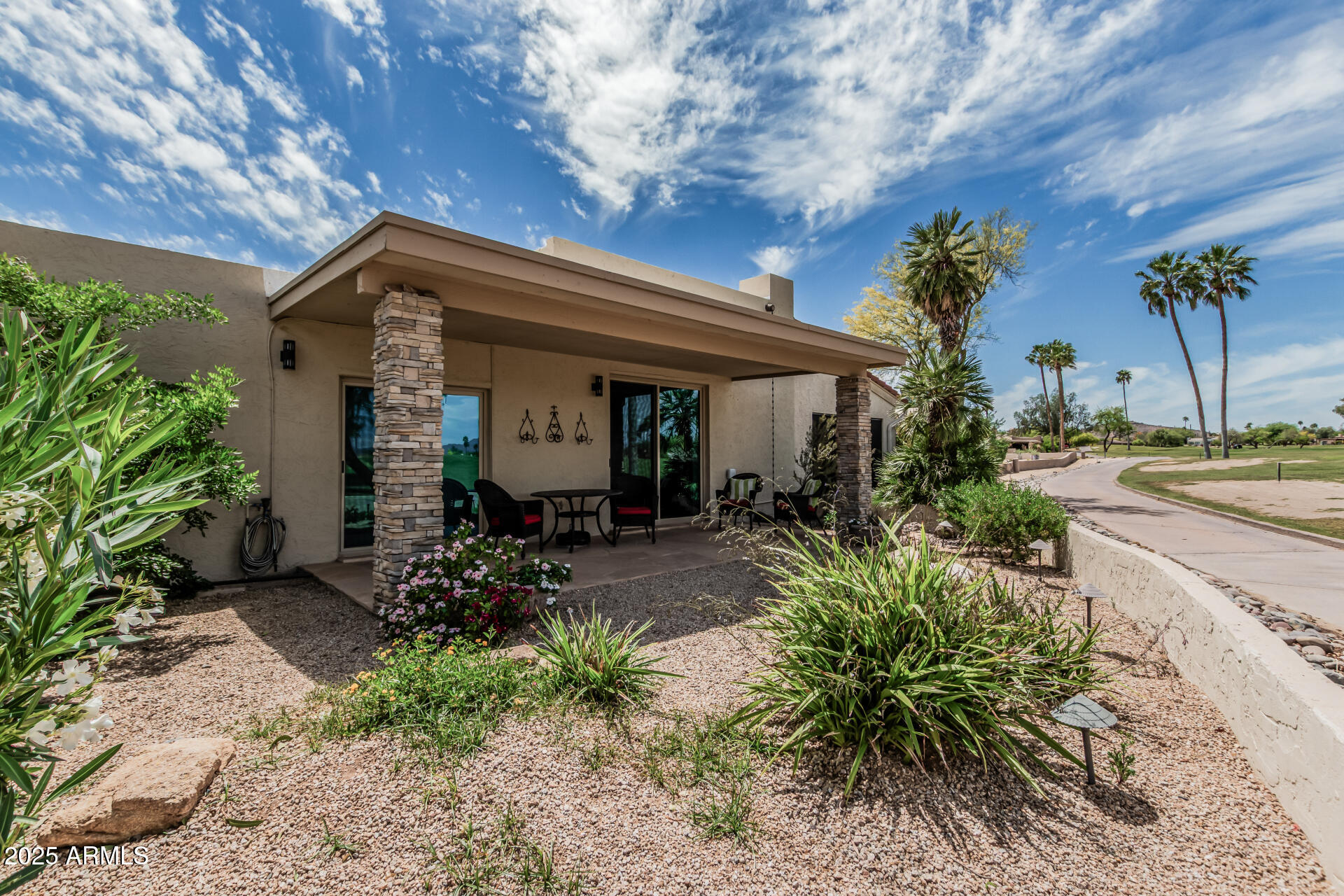 18718 East Rio Lane Rio Verde, AZ 85263 - Photo 59 of 59 a front view of a house with garden