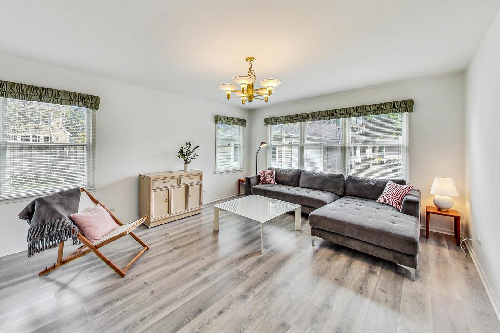 1010 Aurora Way Wheaton, IL 60189 - Photo 12 of 37 a living room with furniture and a chandelier