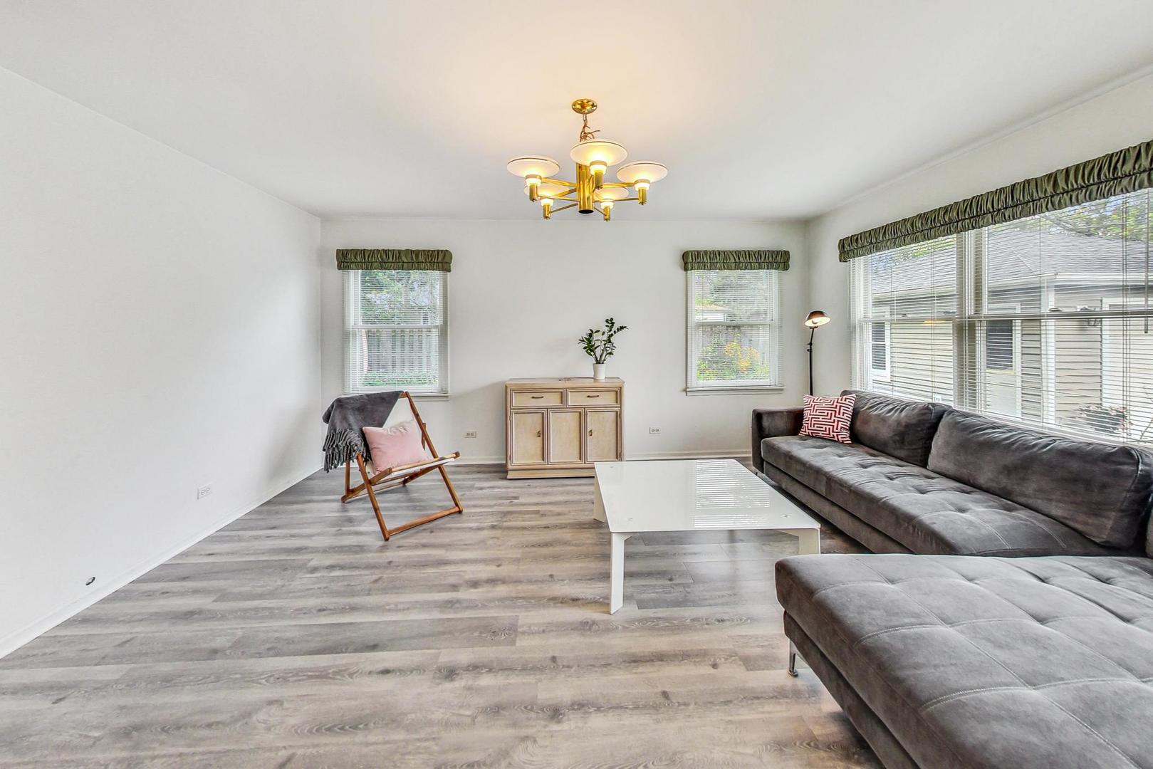 1010 Aurora Way Wheaton, IL 60189 - Photo 13 of 37 a living room with furniture a dining table and a potted plant