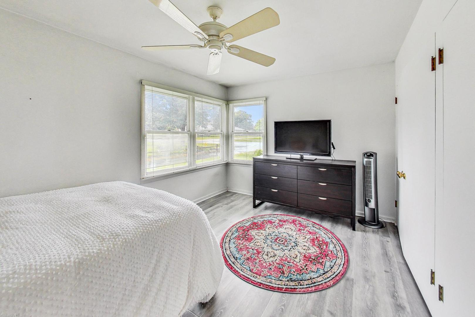 1010 Aurora Way Wheaton, IL 60189 - Photo 16 of 37 a spacious bedroom with a bed and a flat screen tv