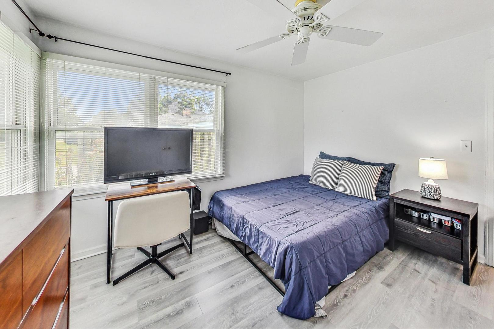 1010 Aurora Way Wheaton, IL 60189 - Photo 20 of 37 a bedroom with a bed window and a flat screen tv