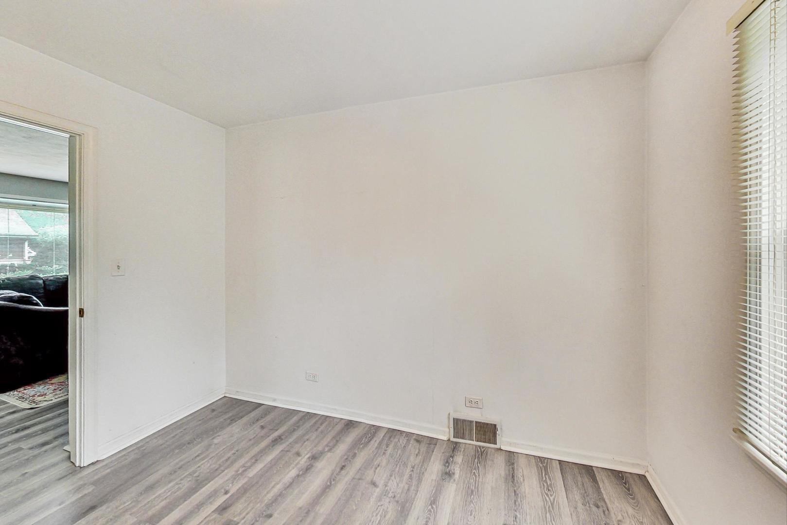 1010 Aurora Way Wheaton, IL 60189 - Photo 24 of 37 a view of a small space with wooden floor and a window
