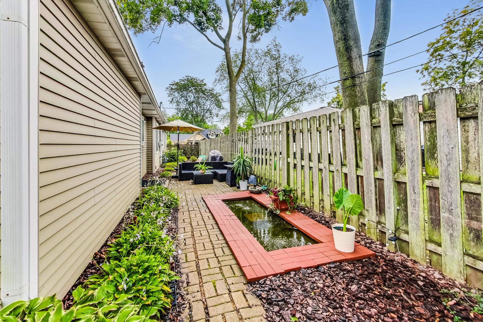1010 Aurora Way Wheaton, IL 60189 - Photo 33 of 37 a view of a back yard with a patio