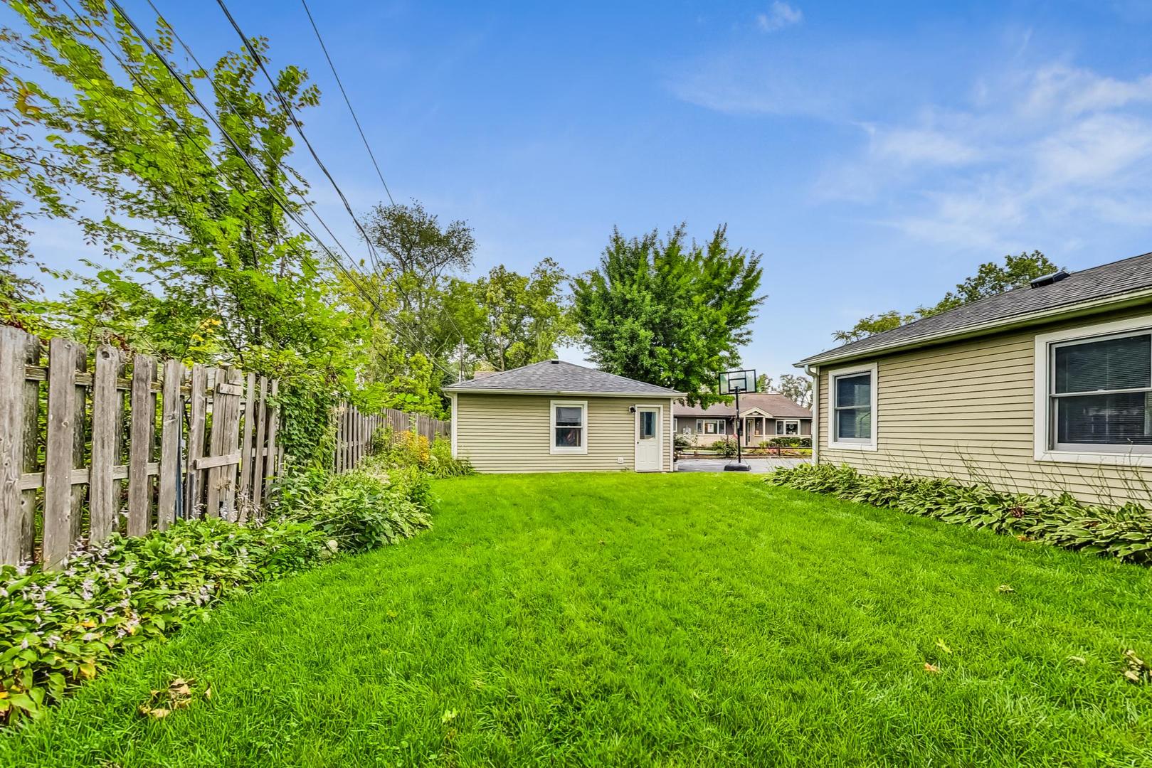 1010 Aurora Way Wheaton, IL 60189 - Photo 36 of 37 a house view with a garden space