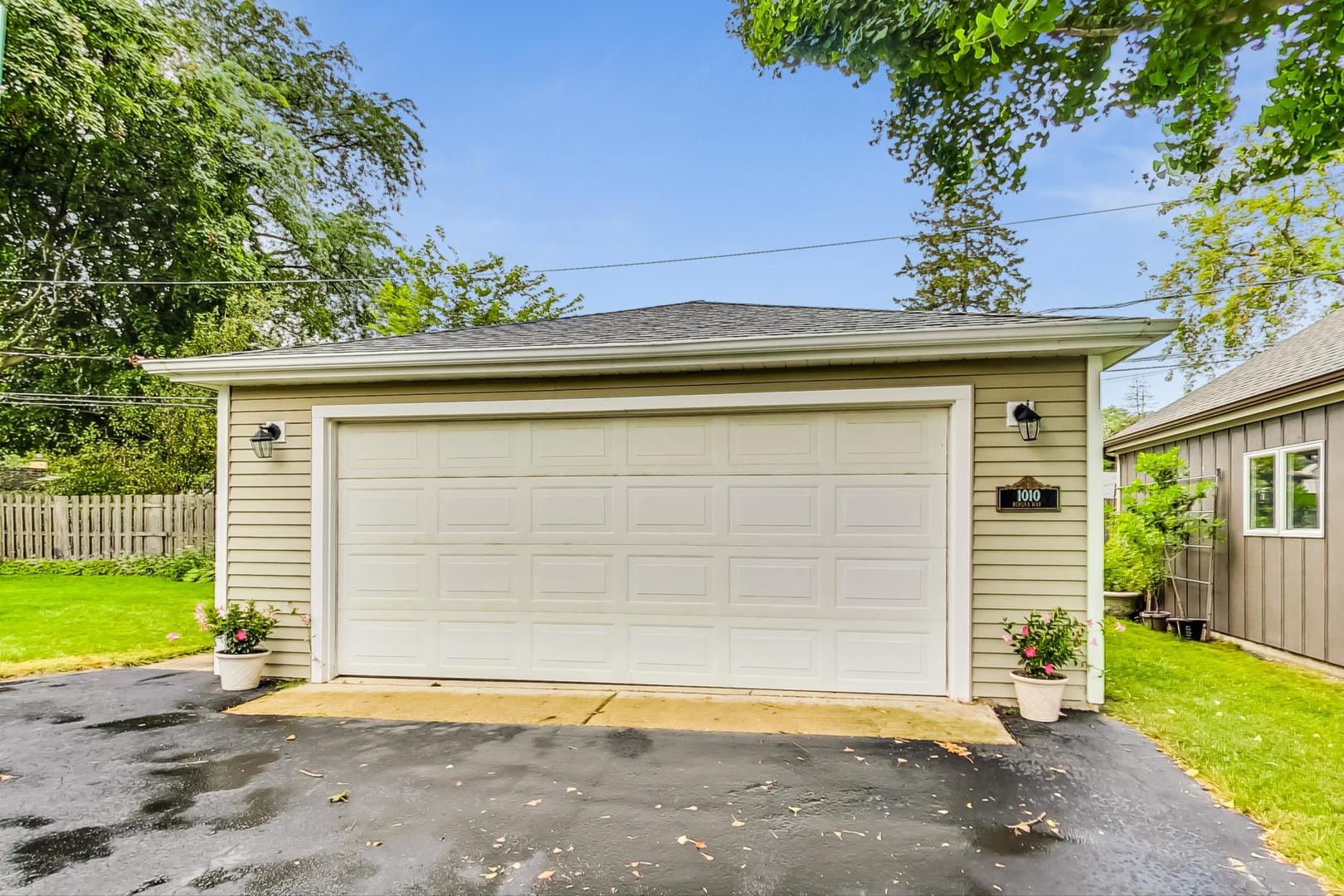 1010 Aurora Way Wheaton, IL 60189 - Photo 37 of 37 a front view of a house with a yard