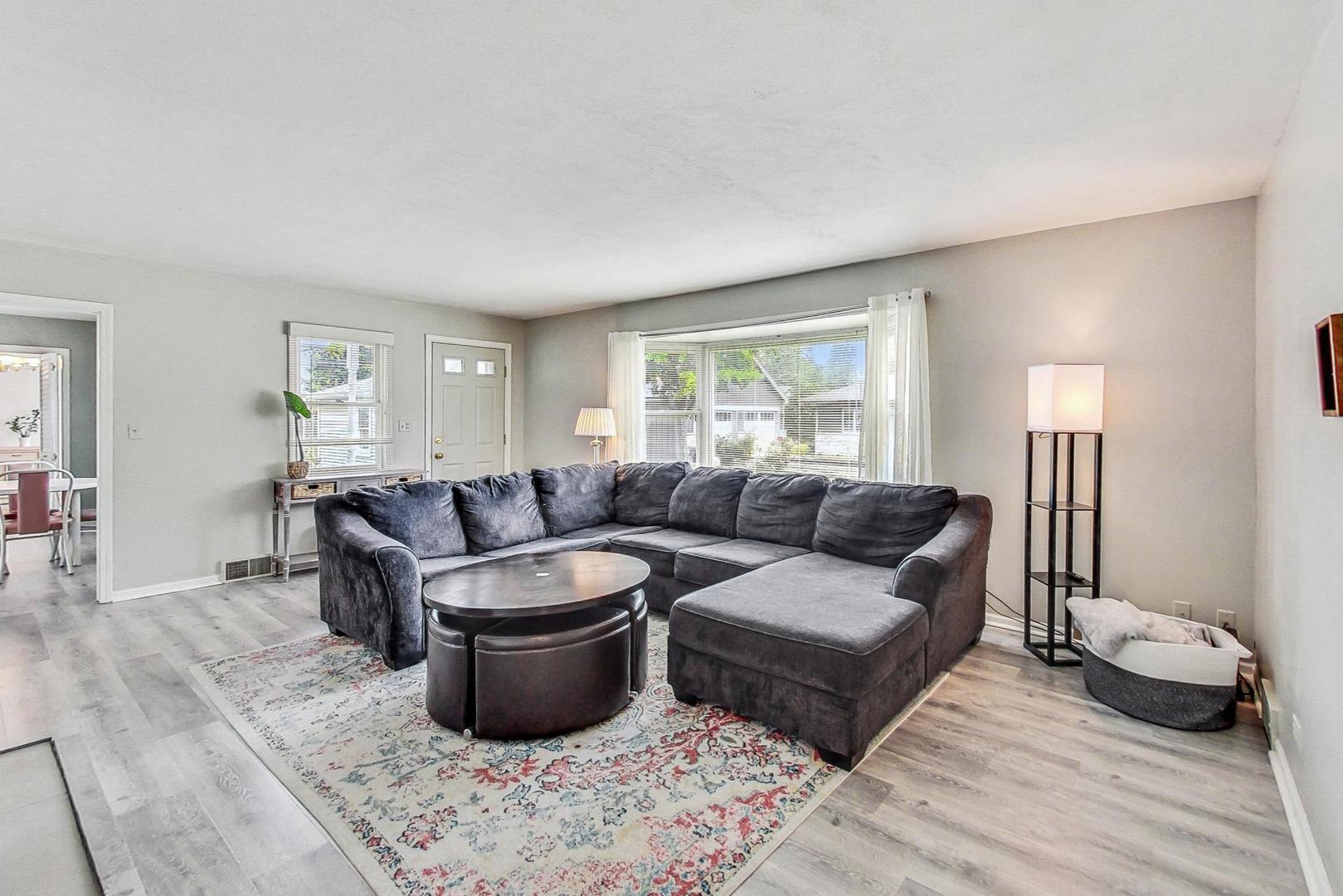 1010 Aurora Way Wheaton, IL 60189 - Photo 6 of 37 a living room with furniture and a wooden floor