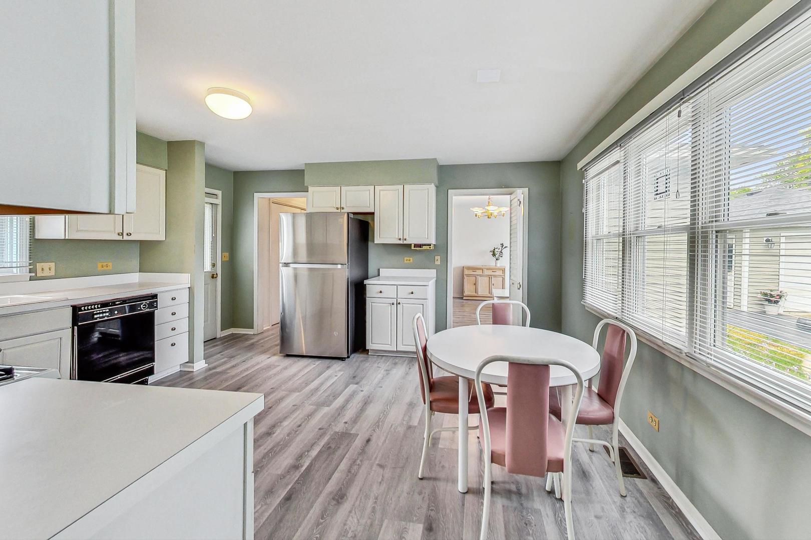 1010 Aurora Way Wheaton, IL 60189 - Photo 9 of 37 a living room with furniture and a fireplace