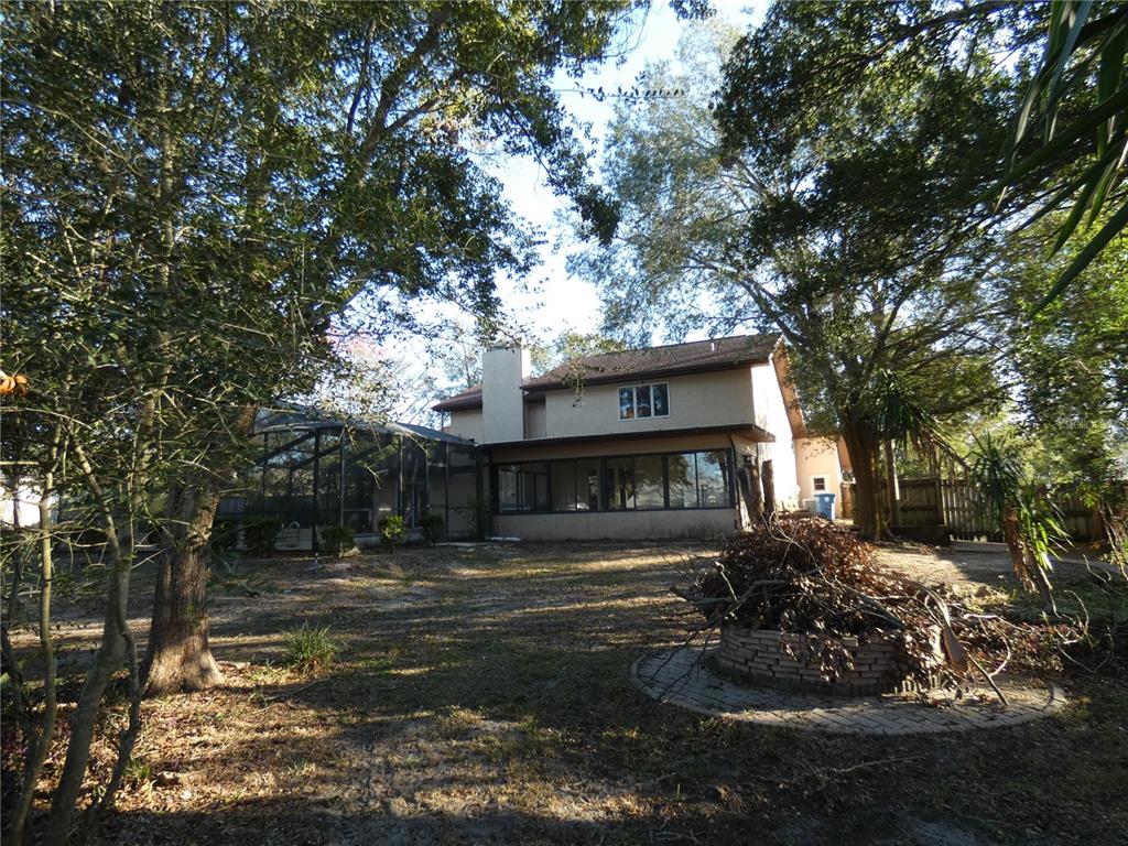 8526 Delaware Drive Weeki Wachee, FL 34607 - Photo 2 of 5 a front view of a house with a yard