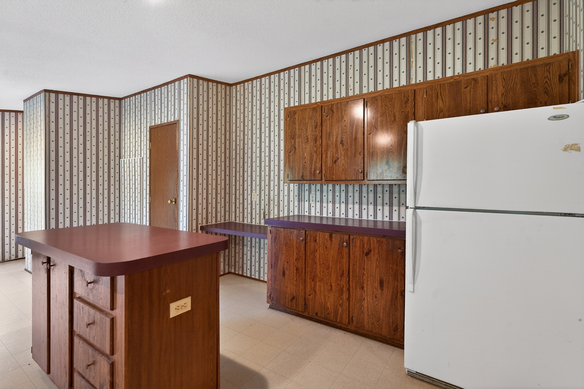 228 Shasteen Ridge Road Lynchburg, TN 37352 - Photo 27 of 53 a kitchen with a refrigerator a stove top oven a sink and a dishwasher