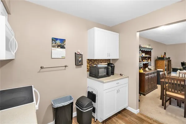 a kitchen with a stove and a refrigerator