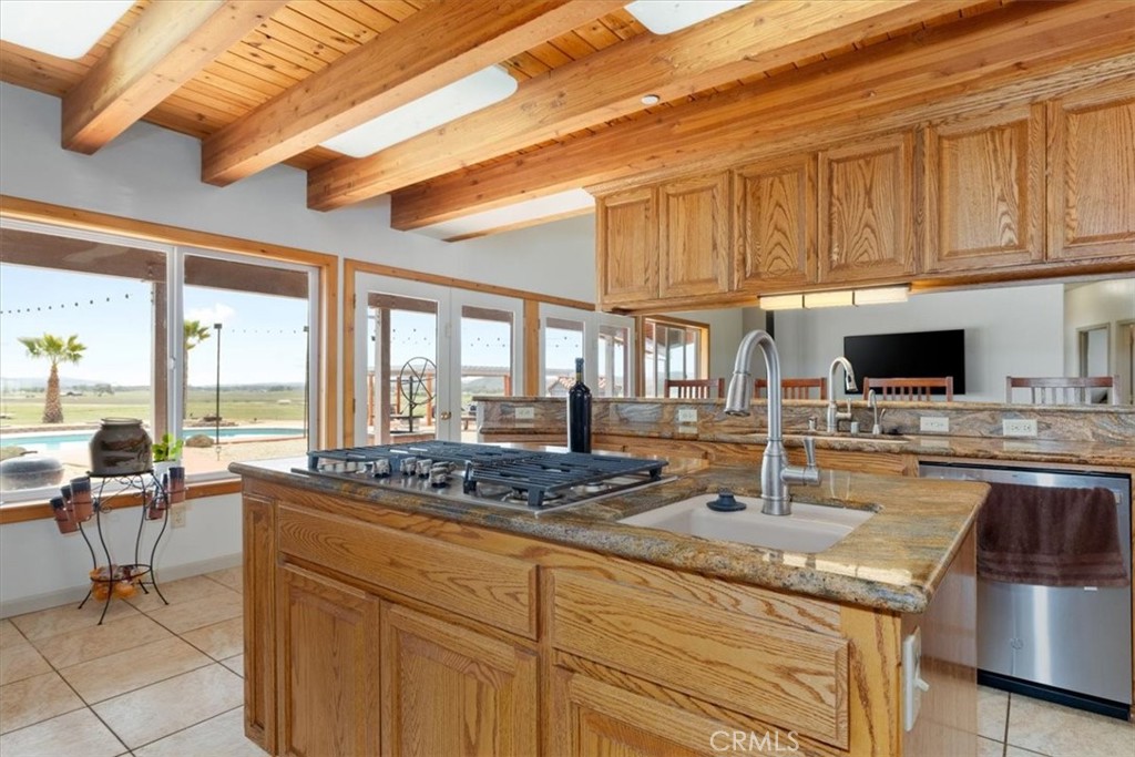 67911 Jolon Road Lockwood, CA 93932 - Photo 13 of 29 a kitchen with stainless steel appliances granite countertop a sink stove and cabinets