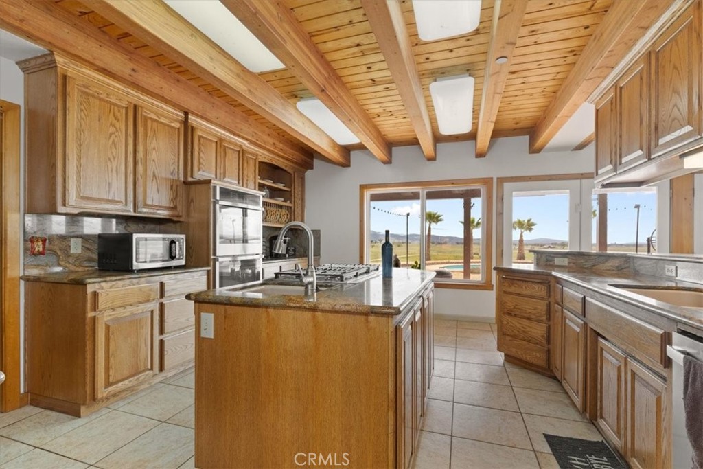 67911 Jolon Road Lockwood, CA 93932 - Photo 14 of 29 a room with stainless steel appliances granite countertop a sink a stove and cabinets