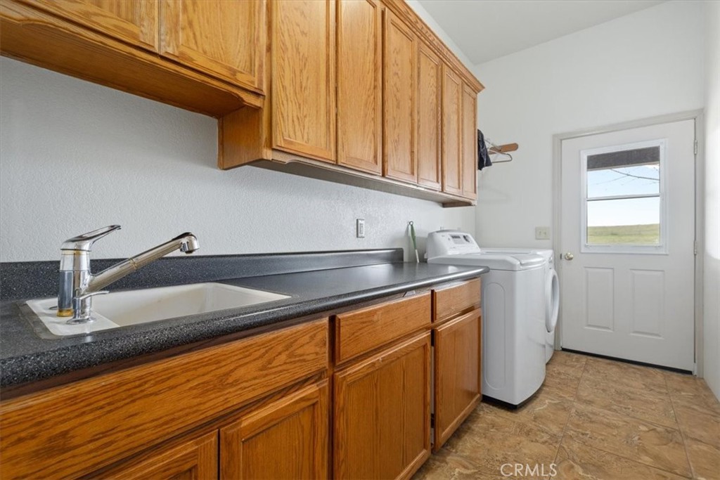 67911 Jolon Road Lockwood, CA 93932 - Photo 19 of 29 a kitchen with stainless steel appliances granite countertop a sink and cabinets