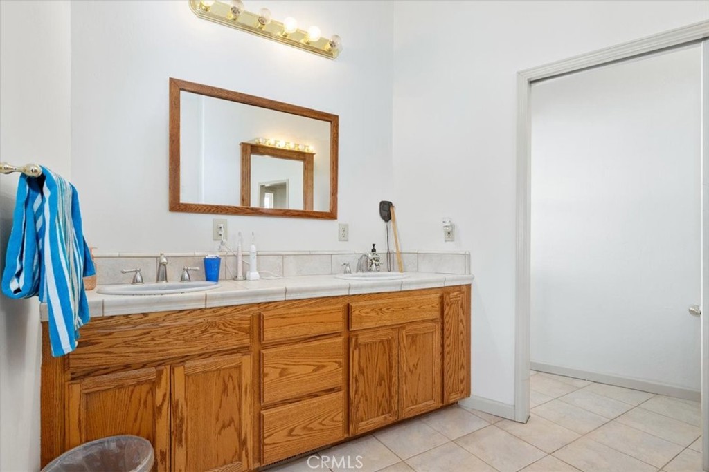 67911 Jolon Road Lockwood, CA 93932 - Photo 24 of 29 a bathroom with a sink vanity and mirror