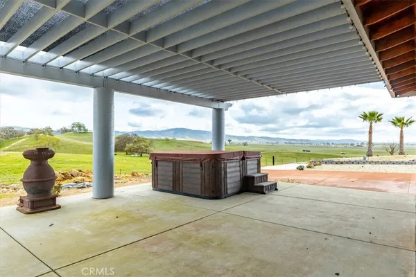 a view of a swimming pool with a patio