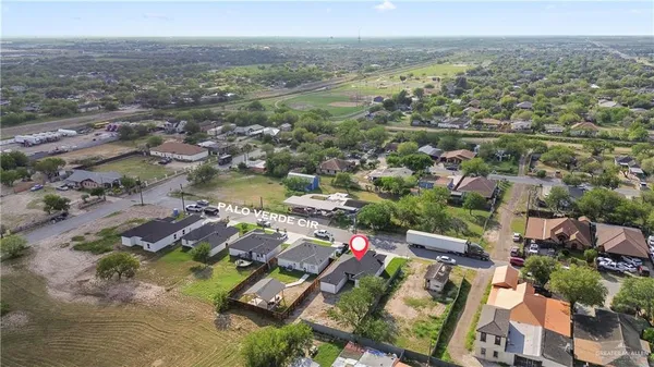 an aerial view of a house with a yard