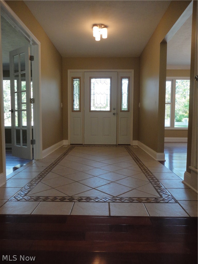 19646 Prospect Road Strongsville, OH 44149 - Photo 5 of 32 Foyer with office through the French Glass doors and the formal dining room opposite both with hardwood floors.