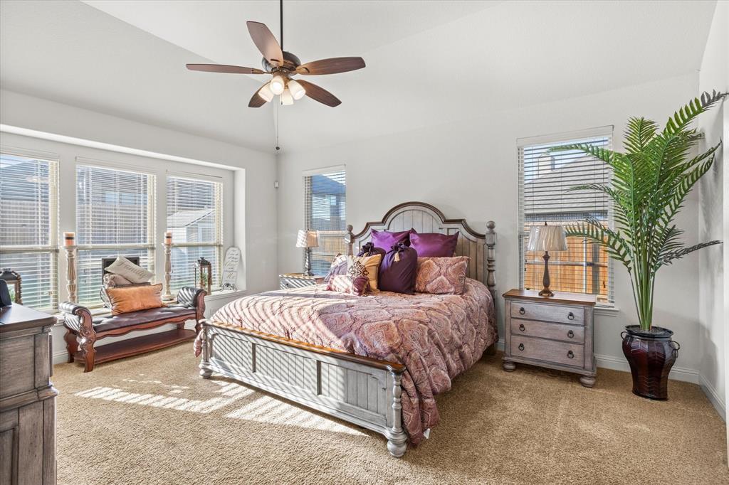 1814 Chadwick Lane Forney, TX 75126 - Photo 22 of 40 Bedroom with carpet floors, lofted ceiling, and a ceiling fan