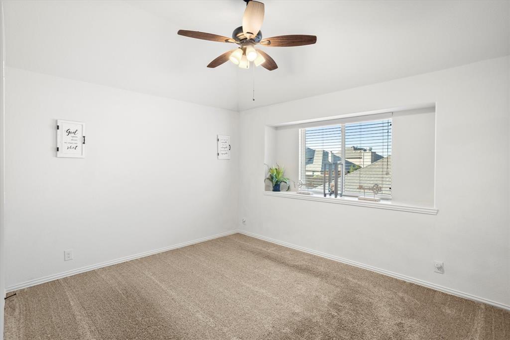 1814 Chadwick Lane Forney, TX 75126 - Photo 32 of 40 Carpeted empty room with baseboards and a ceiling fan
