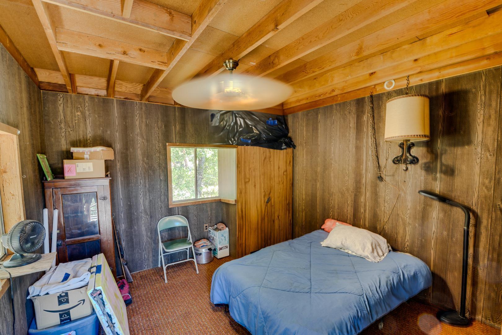 4160 Quatal Canyon Road Maricopa, CA 93252 - Photo 12 of 31 a bedroom with a bed and wooden floor