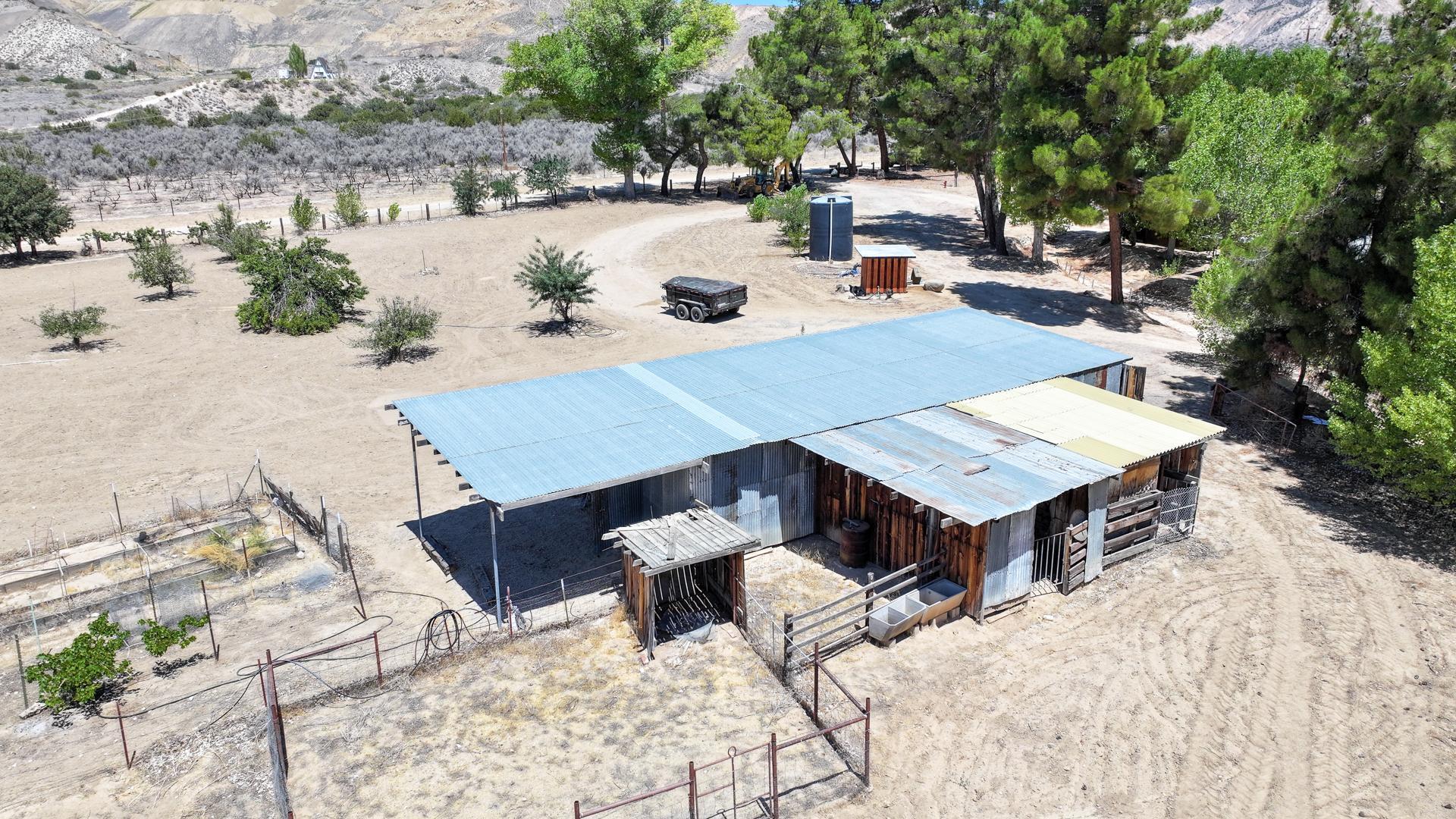 4160 Quatal Canyon Road Maricopa, CA 93252 - Photo 23 of 31 a roof deck with table and chairs couches with wooden floor and fence