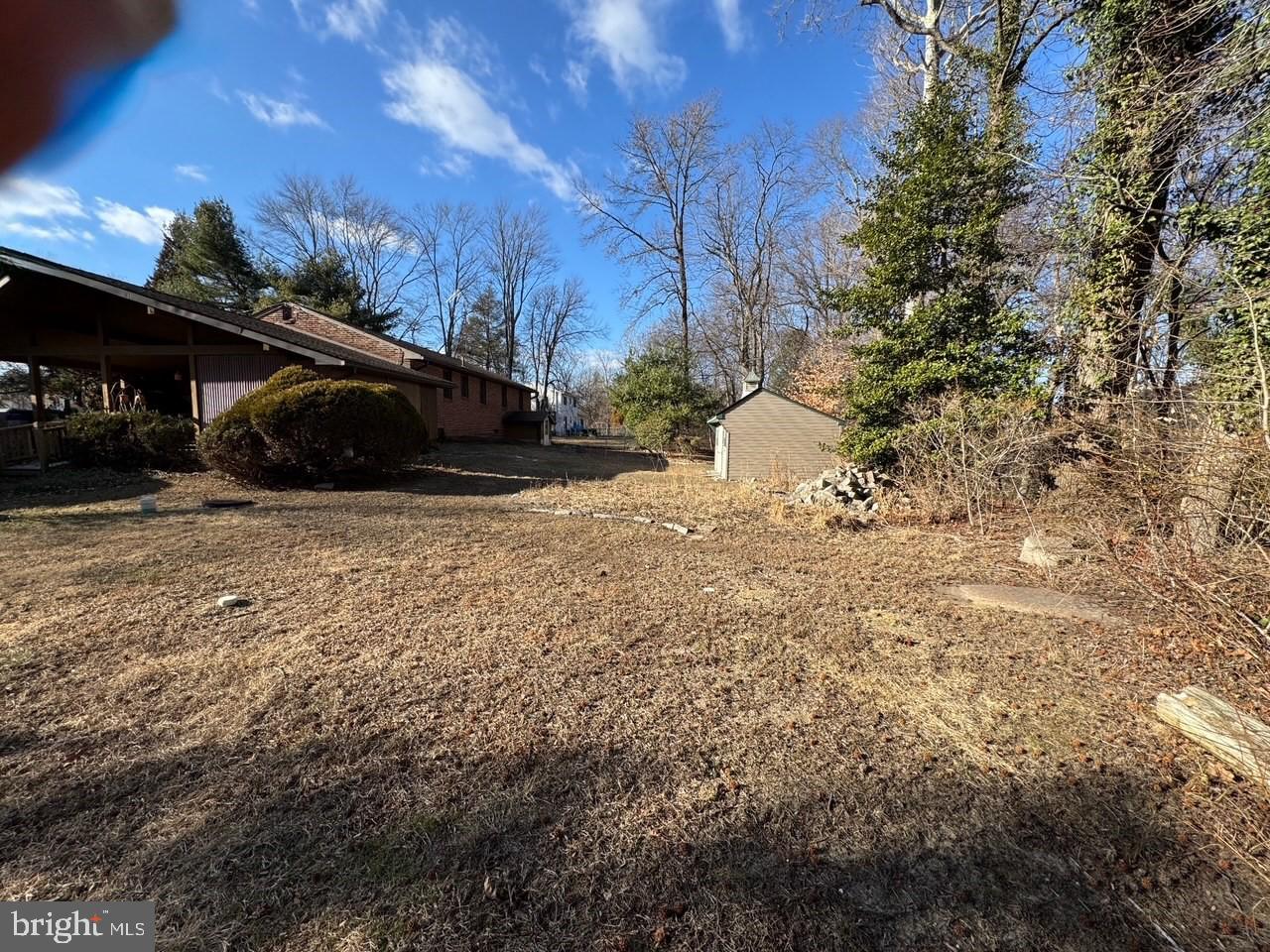305 Kresson Road Voorhees, NJ 08043 - Photo 4 of 37 a view of a yard with trees in front of house