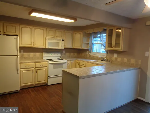 a view of a house and a kitchen