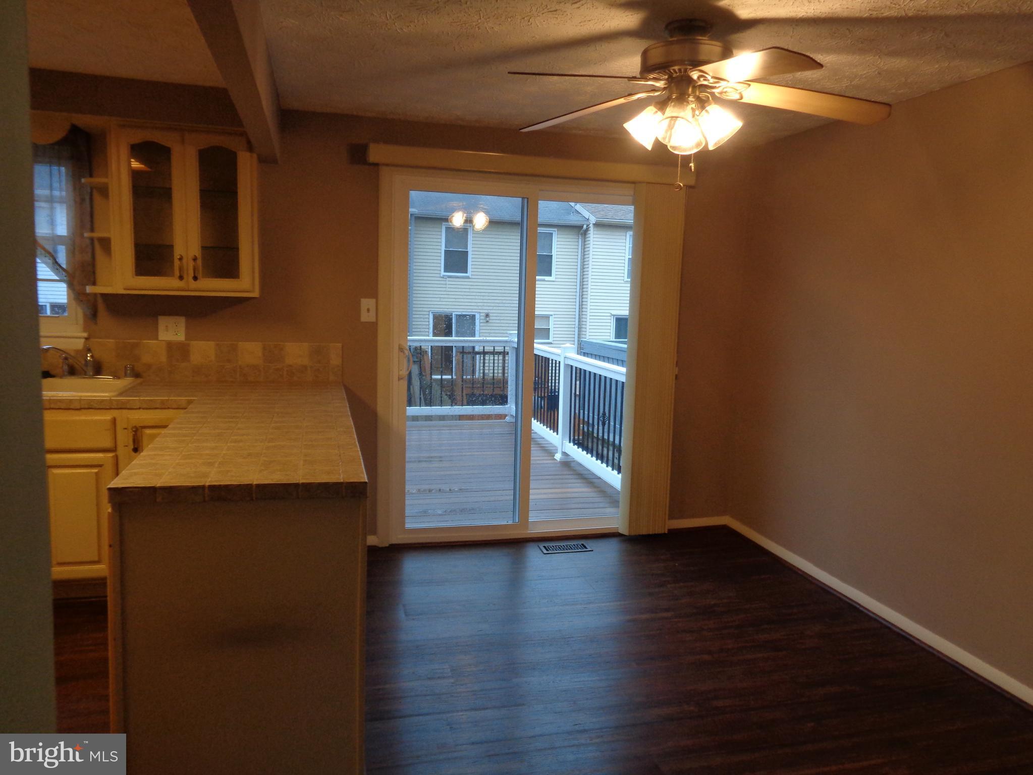 4020 Rustico Road Middle River, MD 21220 - Photo 24 of 59 a view of empty room with wooden floor and fan
