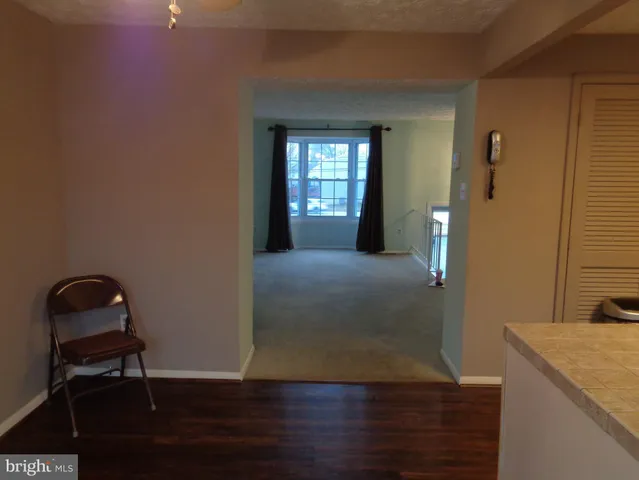 a view of a balcony with wooden floor