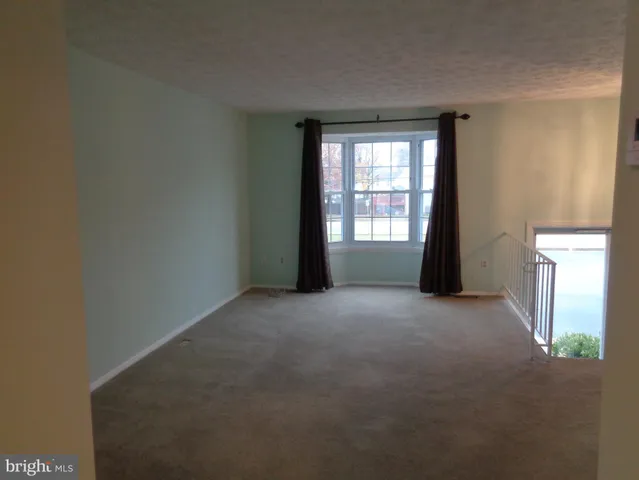 a view of a balcony with wooden floor