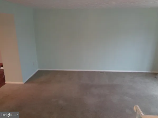 a view of a brick house with many windows