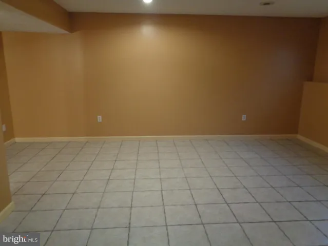 a balcony with table and chairs