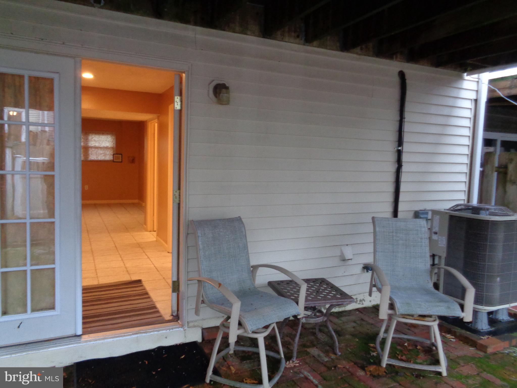 4020 Rustico Road Middle River, MD 21220 - Photo 56 of 59 a balcony with table and chairs